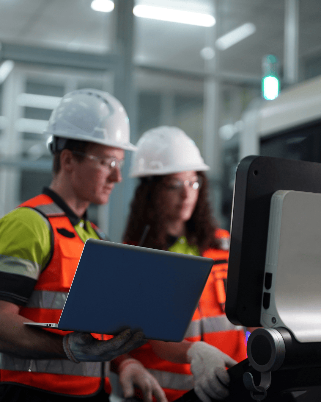 Two people in a manufacturing company searching for documents
